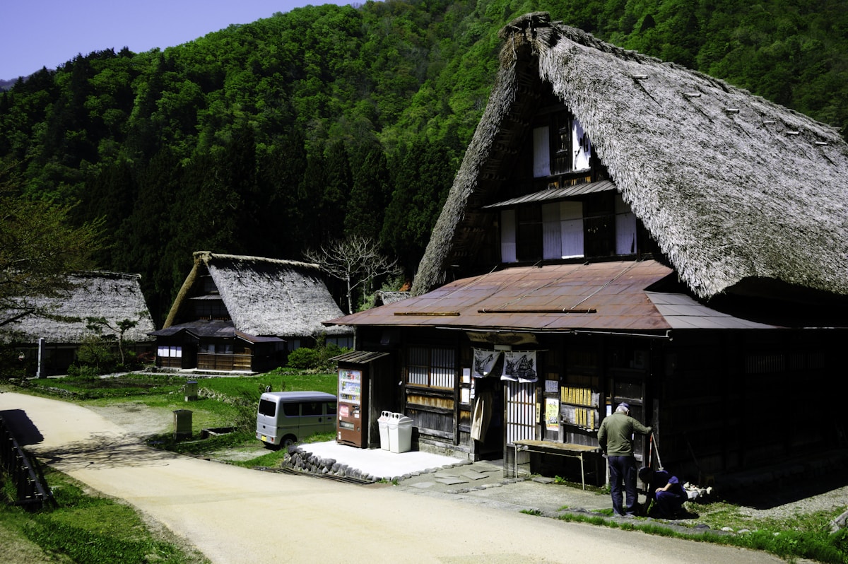 Traditional Japanese houses in a scenic rural village surrounded by nature