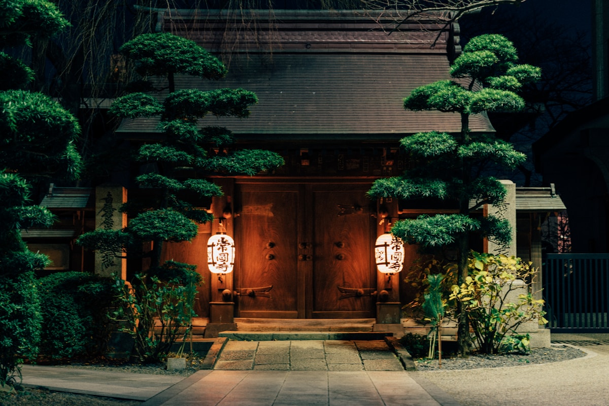 Atmospheric Japanese entrance at night with traditional lanterns
