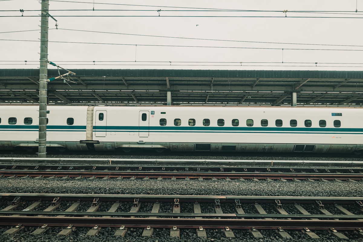 White shinkansen bullet train at a Japanese station platform