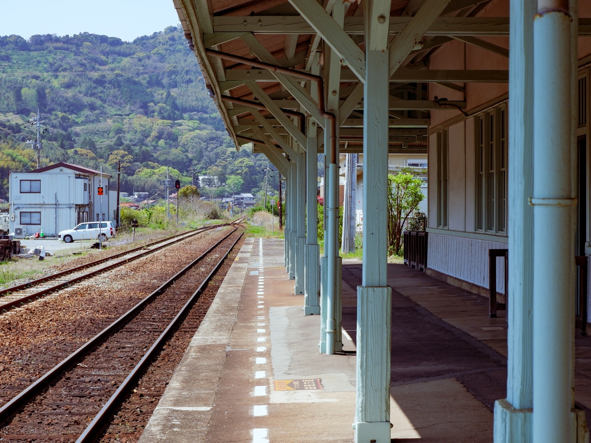 Japanese suburban train station with a train on the platform