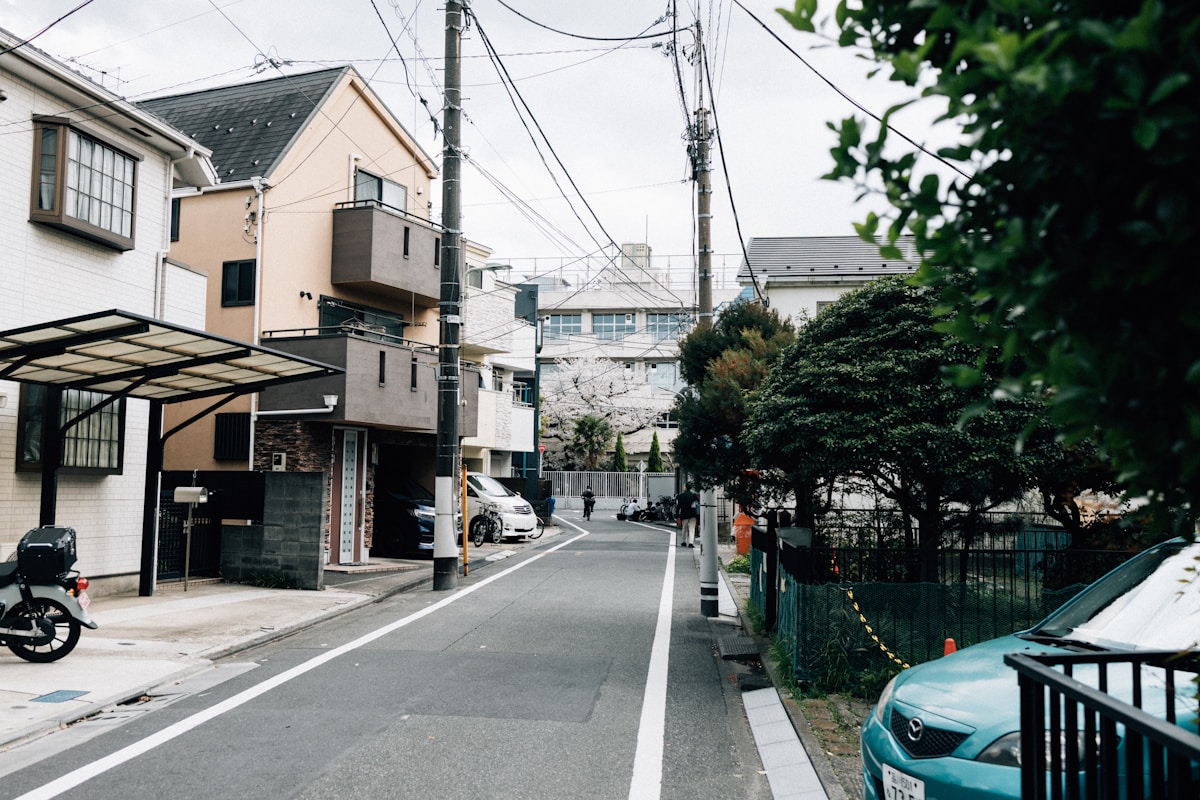 Quiet Japanese residential street with cherry blossoms