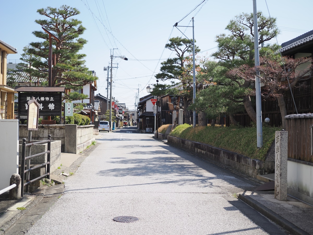 A quiet street in a Japanese town with traditional buildings