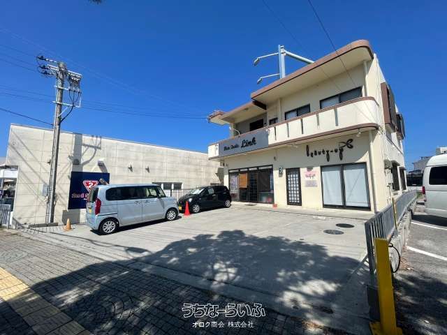 Uruma City Mixed-Use Property with Shop Rentals & Vacant Residence - Image 1
