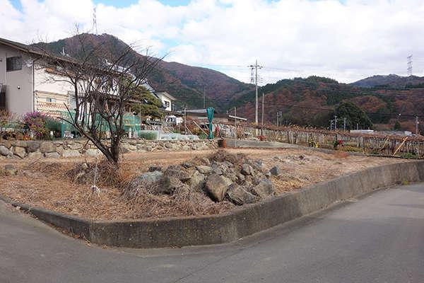 a hilly area down south with a view of Mt. Fuji in front - Thumbnail 4